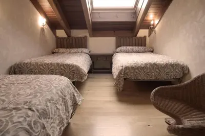 Cama o camas de una habitación en La Casona del Tormes