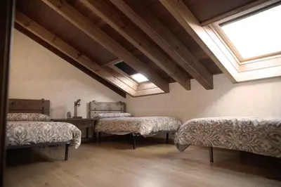 Cama o camas de una habitación en La Casona del Tormes