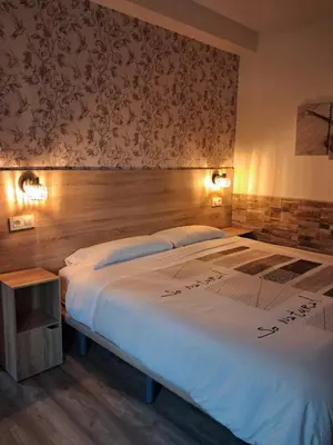 Cama o camas de una habitación en Hostal La Pastora