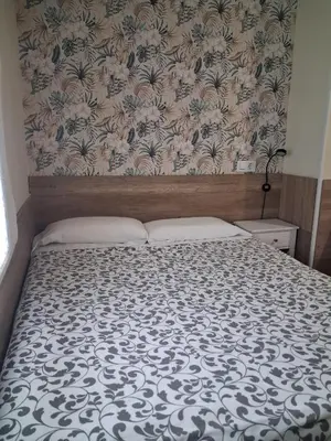 Cama o camas de una habitación en Hostal La Pastora