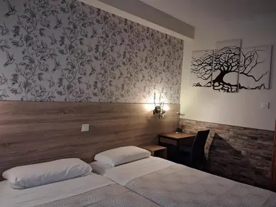 Cama o camas de una habitación en Hostal La Pastora