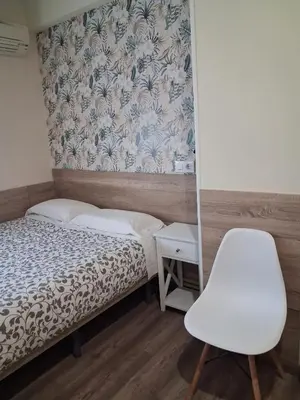Cama o camas de una habitación en Hostal La Pastora