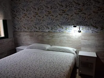 Cama o camas de una habitación en Hostal La Pastora