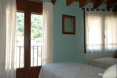Cama o camas de una habitación en El Capricho de Ana