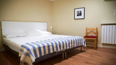 Cama o camas de una habitación en Apartamentos San Pablo