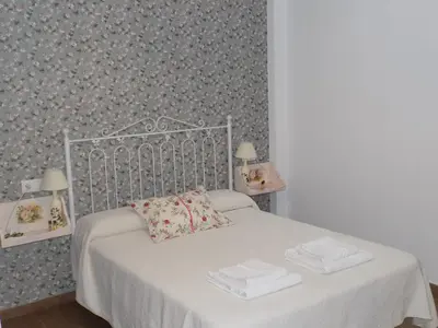 Cama o camas de una habitación en El Capricho Casa Rural