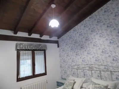 Cama o camas de una habitación en El Capricho Casa Rural