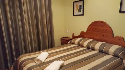Cama o camas de una habitación en Hostal Maury