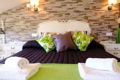 Cama o camas de una habitación en Atico Romántico