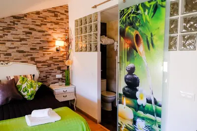 Cama o camas de una habitación en Atico Romántico