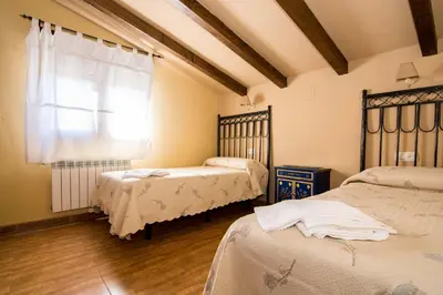 Cama o camas de una habitación en El Leñador II