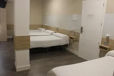 Cama o camas de una habitación en Deluxe Hostels & Suites Merida