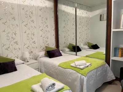 Cama o camas de una habitación en Apartamentos Gran Via