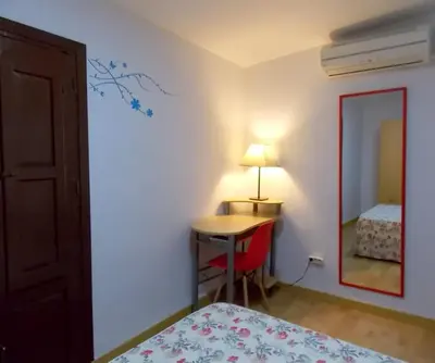 Cama o camas de una habitación en Apartamentos Capuchinas
