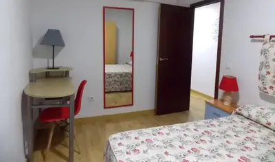 Cama o camas de una habitación en Apartamentos Capuchinas