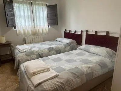 Cama o camas de una habitación en Vivienda de uso turístico La Vega de Vita