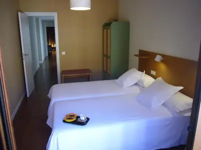 Cama o camas de una habitación en Littore TORMES con Parking, AA y Piscina