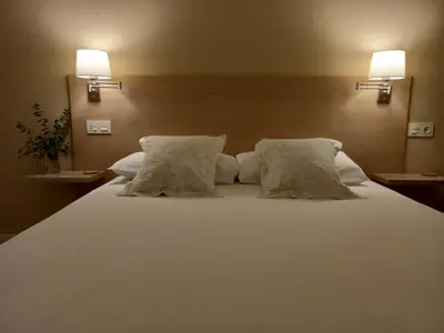 Cama o camas de una habitación en Littore TORMES con Parking, AA y Piscina