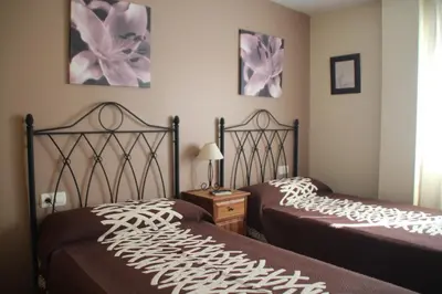 Cama o camas de una habitación en Hostal Zaguan