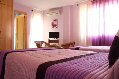 Cama o camas de una habitación en Hostal Zaguan