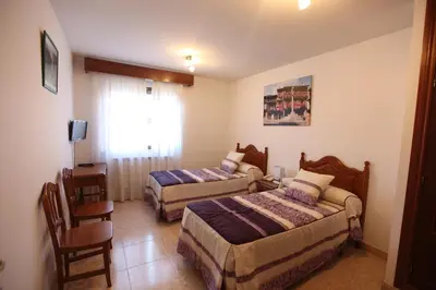 Cama o camas de una habitación en Hostal San Blas