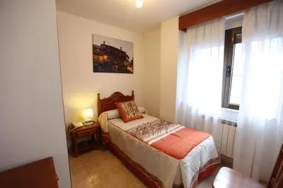 Cama o camas de una habitación en Hostal San Blas