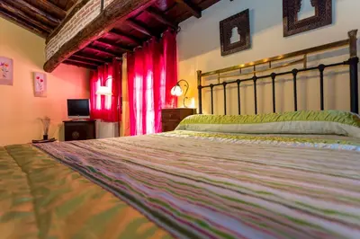 Cama o camas de una habitación en El castanar