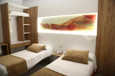 Cama o camas de una habitación en Hostal Real