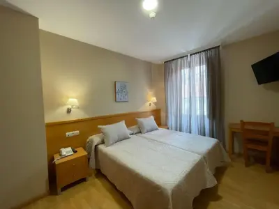 Cama o camas de una habitación en Hotel Castilla