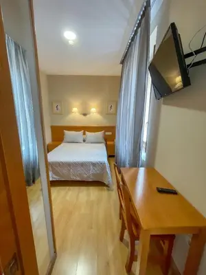 Cama o camas de una habitación en Hotel Castilla