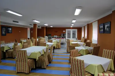 Un restaurante o sitio para comer en AHC Hoteles