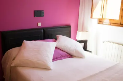Cama o camas de una habitación en Gran Hostal San Segundo