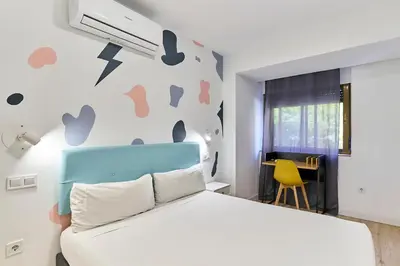 Cama o camas de una habitación en Hostal Carmen by gaiarooms