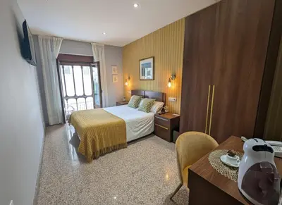 Cama o camas de una habitación en Hotel Arcos Catedral