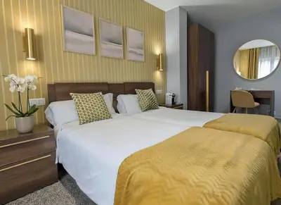 Cama o camas de una habitación en Hotel Arcos Catedral