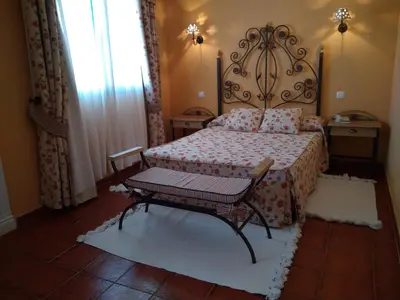 Cama o camas de una habitación en Hotel Alonso de Monroy
