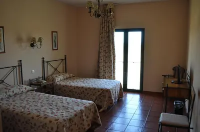 Cama o camas de una habitación en Hotel Alonso de Monroy