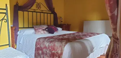 Cama o camas de una habitación en Hospederia Doña Ligia