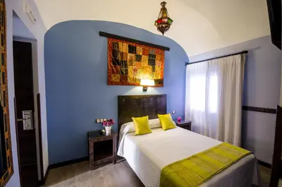 Cama o camas de una habitación en La Flor De Al-Andalus