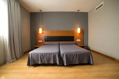 Cama o camas de una habitación en Hotel Romero Merida