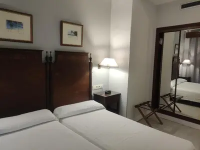 Cama o camas de una habitación en Hotel Iberia Plaza América