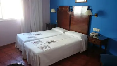 Cama o camas de una habitación en Hotel Iberia Plaza América