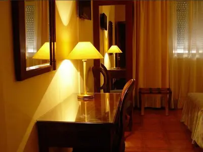 Cama o camas de una habitación en Hotel Iberia Plaza América