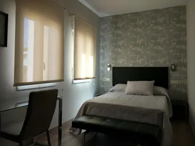 Cama o camas de una habitación en Apartamentos Mitreo