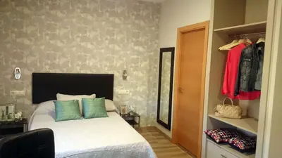 Cama o camas de una habitación en Apartamentos Mitreo