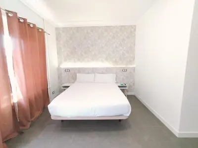 Cama o camas de una habitación en Hostal Gonzala by gaiarooms