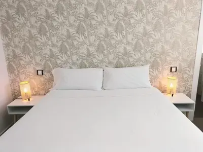 Cama o camas de una habitación en Hostal Gonzala by gaiarooms