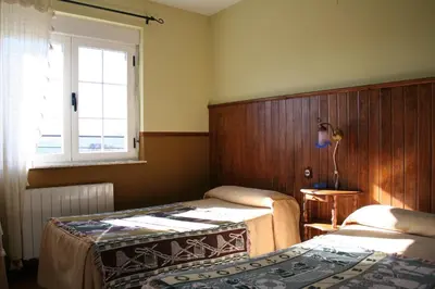 Cama o camas de una habitación en La Casona de Collado