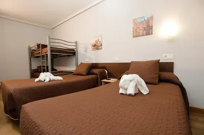 Cama o camas de una habitación en Hostal Conde David