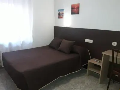 Cama o camas de una habitación en Hostal Conde David